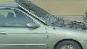 Flipped hood blocks motorist's view while driving miles on I-43