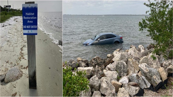 High tide nearly sinks illegally parked car along Courtney Campbell Causeway
