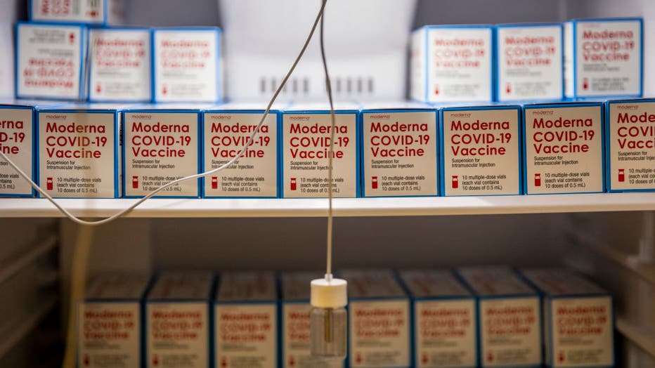 Boxes of the Moderna COVID-19 vaccine sitting in freezers