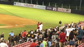 Baseball players confront unruly fans who allegedly poured beer on visiting team