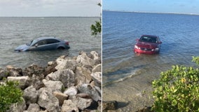 Another illegally parked car nearly sinks in high tide along Courtney Campbell Causeway in Clearwater