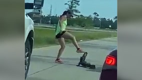 Woman tries to remove alligator from Louisiana highway