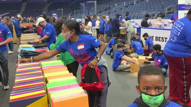 More than 1,000 volunteers stuff 30,000 backpacks for Bay Area children in need