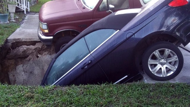 Hole swallows car in Palm Harbor driveway; Bronco spared