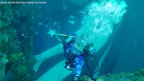 Divers strap US flag to military shipwreck in Florida Keys