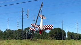 Pilot rescued as small plane dangled from power lines in Georgia