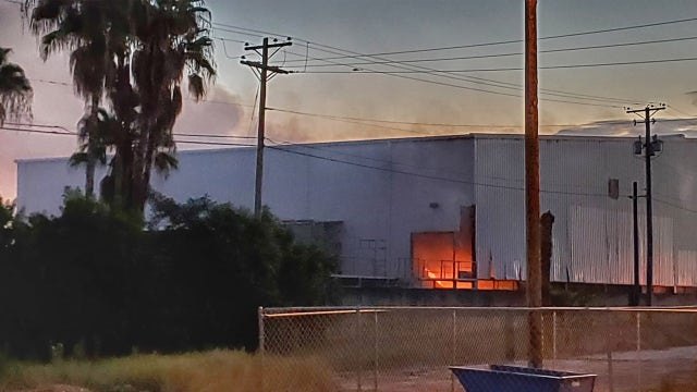 Firefighters battle warehouse fire in Largo