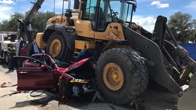 Elderly driver killed after front-end loader backs over car along Winter Haven road