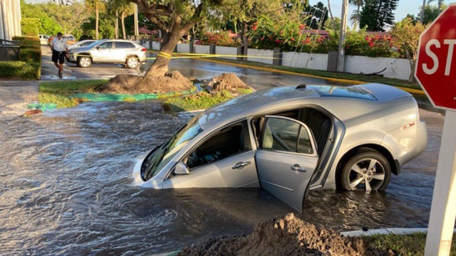 Driver rescued after car plunges into watery hole in Clearwater
