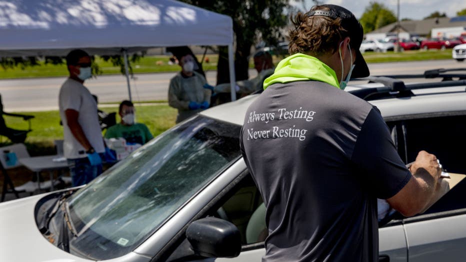 Packed Minivans Line Up For Covid Tests As Children Fall Sick