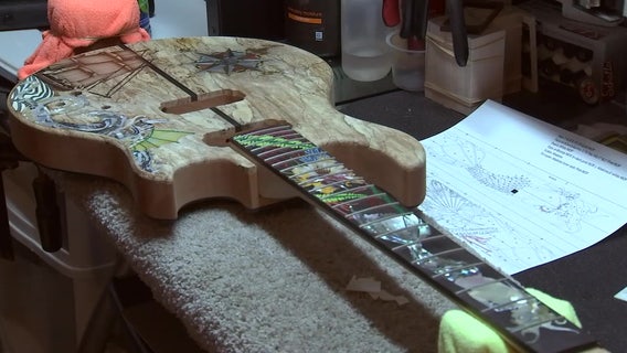 Veteran guitar instructor creating memorial instrument for fallen service members
