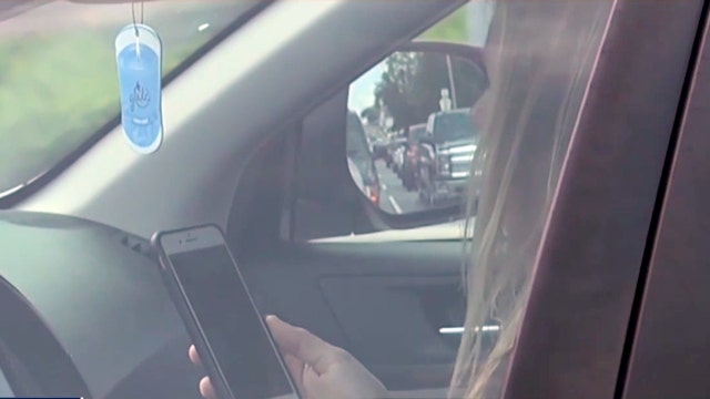 Distracted: 90% of drivers admit using smartphone while driving, study finds
