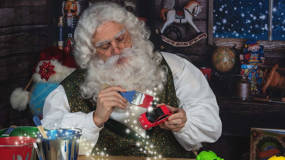 Santa Claus paints toys