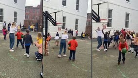 Third-grade teacher sinks viral basketball shot, winning students hot chocolate