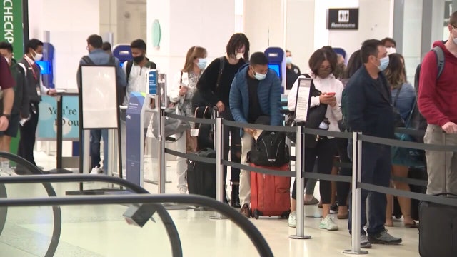 With COVID cases on the rise, medical experts offer tips as Americans put final touches on travel plans