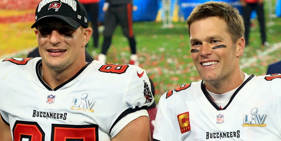 Tom Brady takes batting practice with Rob Gronkowski