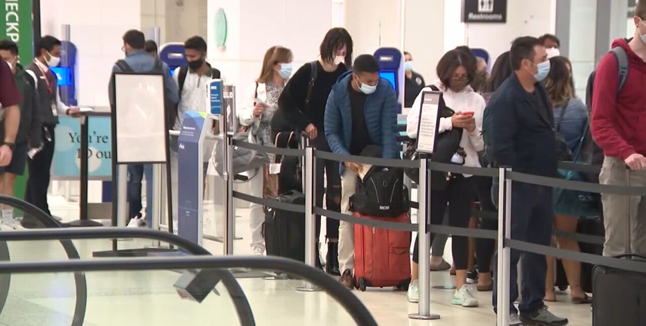 With COVID cases on the rise, medical experts offer tips as Americans put final touches on travel plans