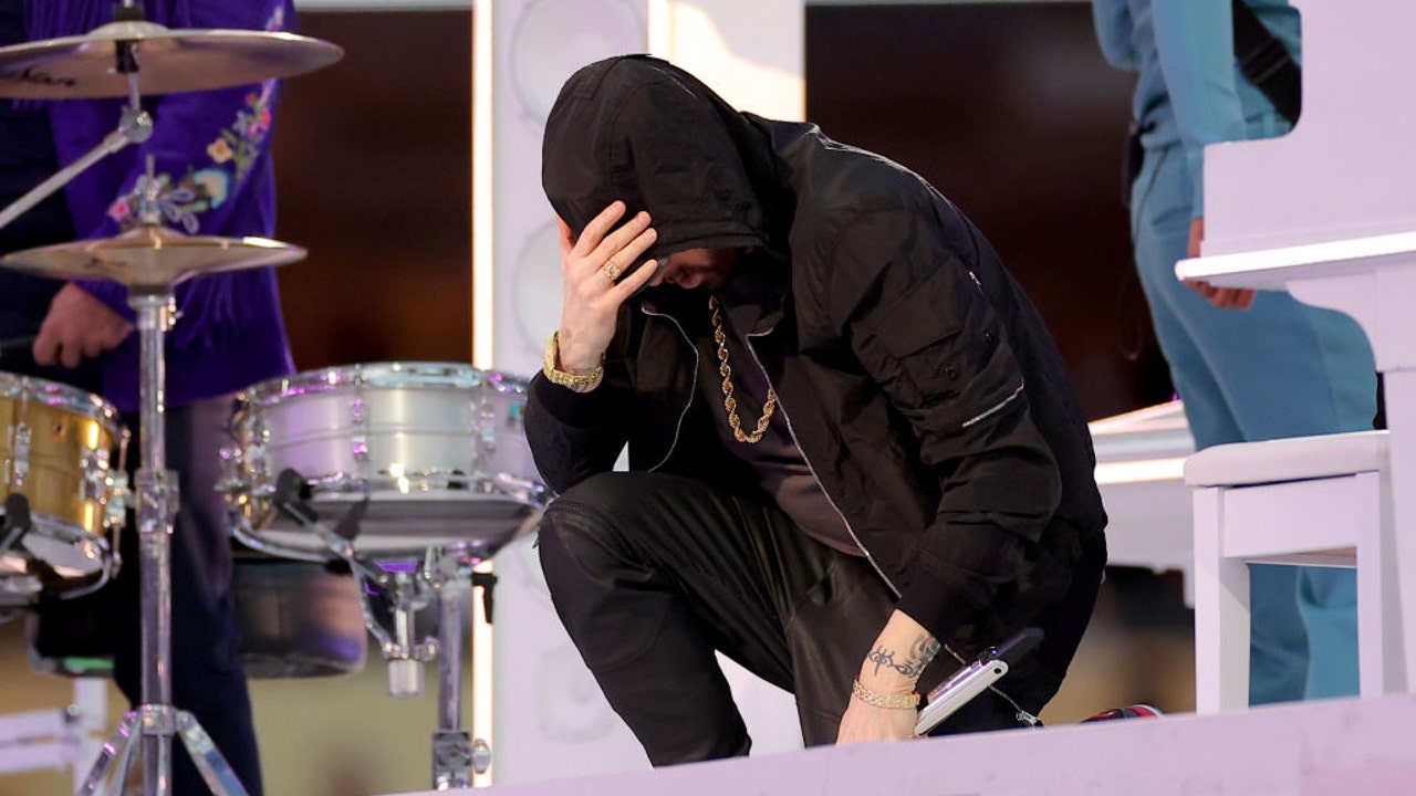 At Super Bowl halftime, Eminem takes a knee, 50 Cent hangs upside