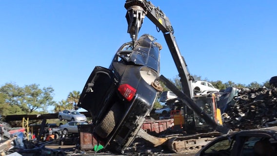 Tampa man’s job of crushing, recycling cars is an organized chaos