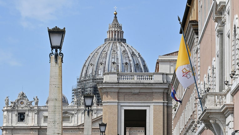 Vatican flag and St. Peter's dome
