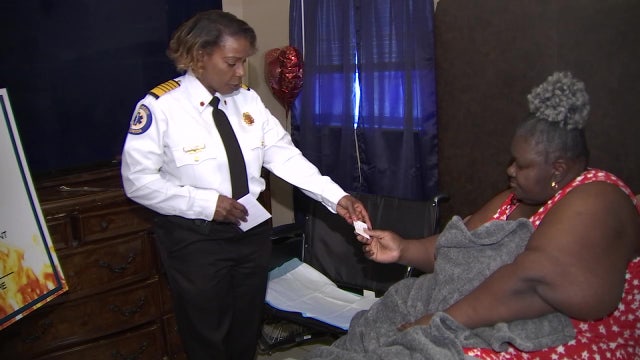 ‘It was my worst fear’: Wheelchair-bound woman reunites with firefighters who saved her life