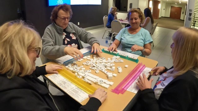 Classic tile-based game makes comeback as players tout its social, cognitive benefits