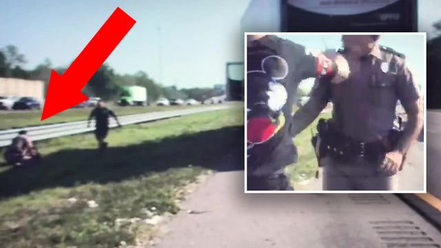 Video: Tampa drivers stop to help FHP trooper attacked by pedestrian on I-4