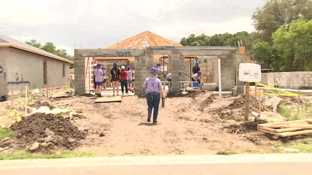 Women literally raise the roof as they build new home for Tampa mother, son