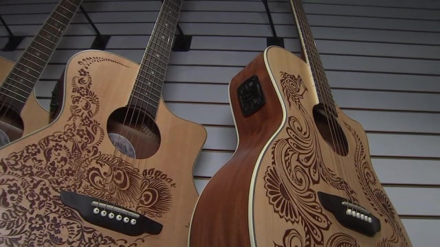 Tampa guitar shop handcrafts artistic, acoustic instruments