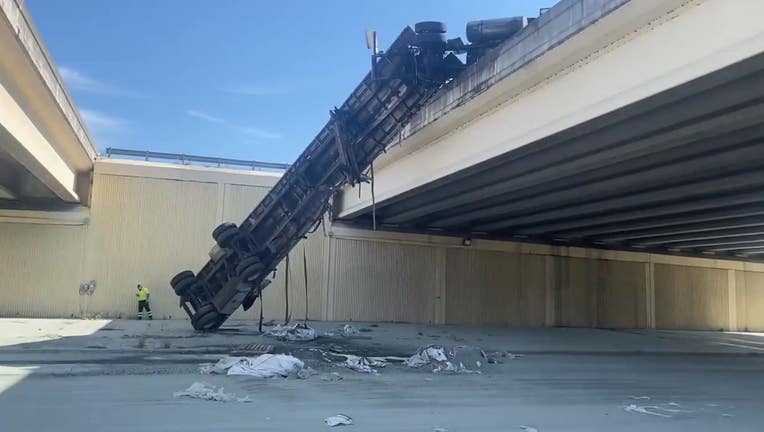 tractor trailer dangling off I-75