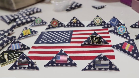 Neatly folding American flags is about patriotism for veteran called Navy Mom Mary