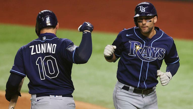 Photo: Kevin Kiermaier and Mike Zunino celebrate home run