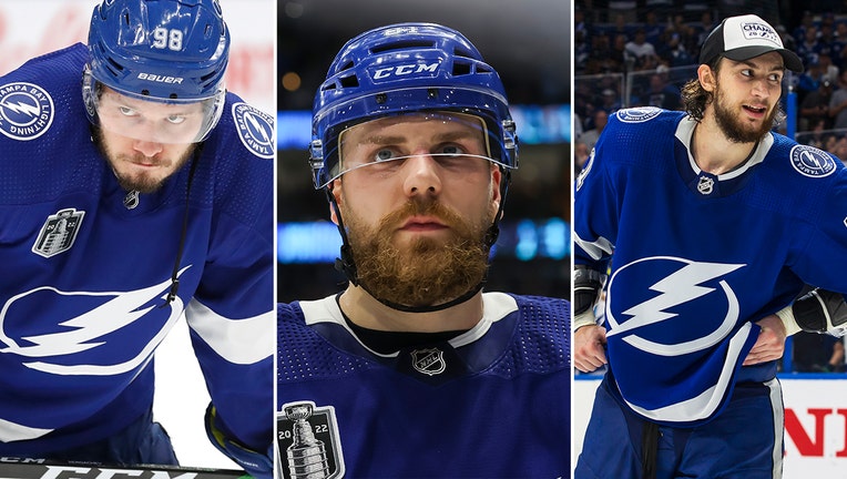 Photo: Compilation of photos showing Mikhail Sergachev, Anthony Cirelli, and Erik Cernak of the Tampa Bay Lightning in their home game uniforms.