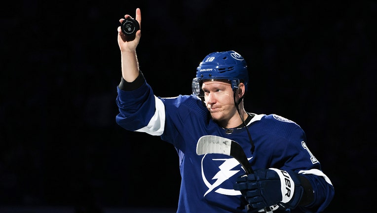 Photo: Ondrej Palat nods at crowd while holding puck