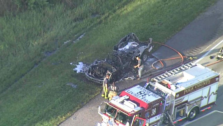 Photo: Aerial view shows charred remains of a vehicle after it was fully engulfed by flames.