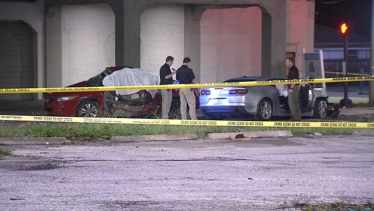 Photo: Scene shows two damaged cars following deadly crash. Crime scene tape is draped around the vehicles.