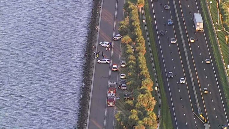 Photo: View from SkyFOX showing police cruisers off Courtney Campbell Causeway where body was found.