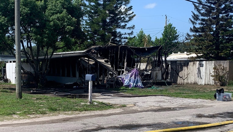 Photo: Mobile home heavily damaged after fire in Holiday, Florida.