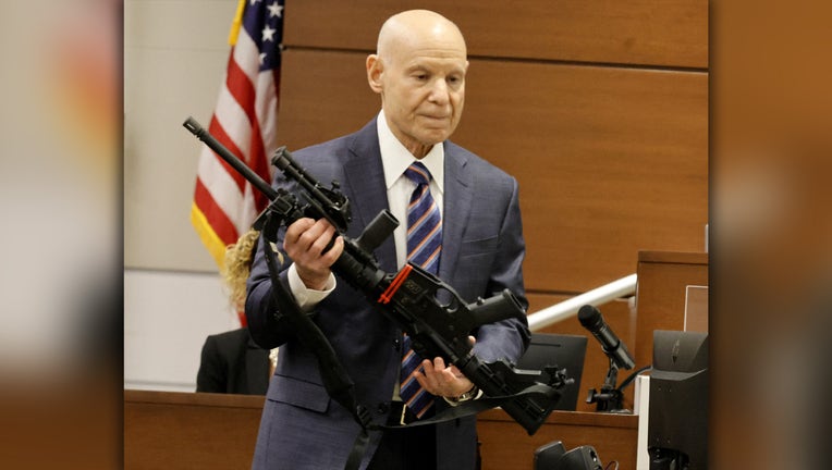 Photo: Assistant State Attorney Mike Satz checks the weapon used in the Marjory Stoneman Douglas High School shooting into evidence, during the penalty phase of Nikolas Cruz's trial at the Broward County Courthouse in Fort Lauderdale, Florida, on July 25, 2022.