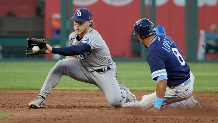 Nicky Lopez #8 of the Kansas City Royals steals second against Taylor Walls #6 of the Tampa Bay Rays in the third inning at Kauffman Stadium on July 22, 2022 in Kansas City, Missouri.