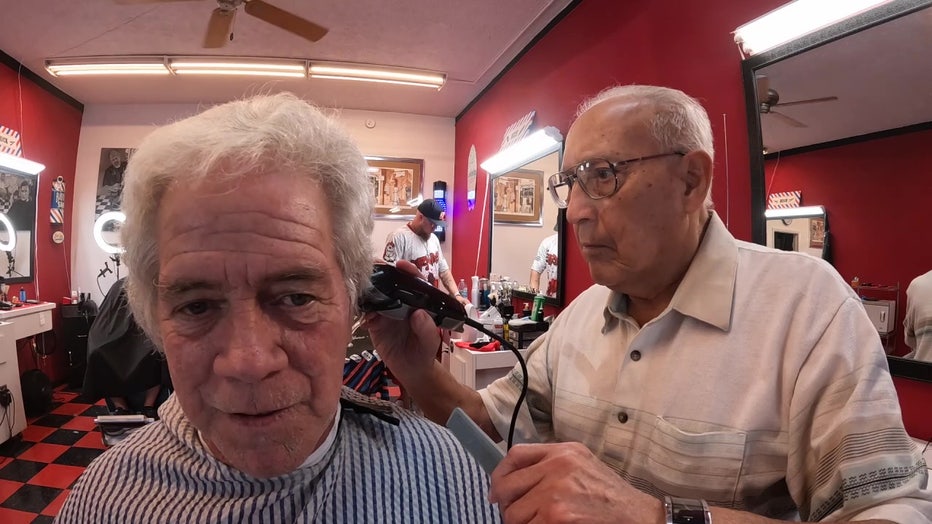 91-year-old barber cuts hair at barber shop on Treasure Island.