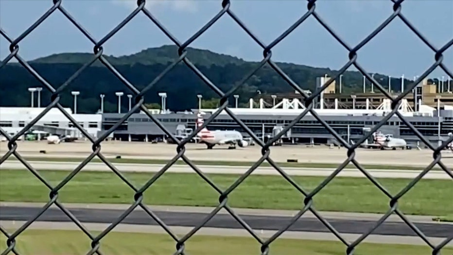 Photo: Image captured through wired fence shows American Airlines plane that landed at Alabama airport