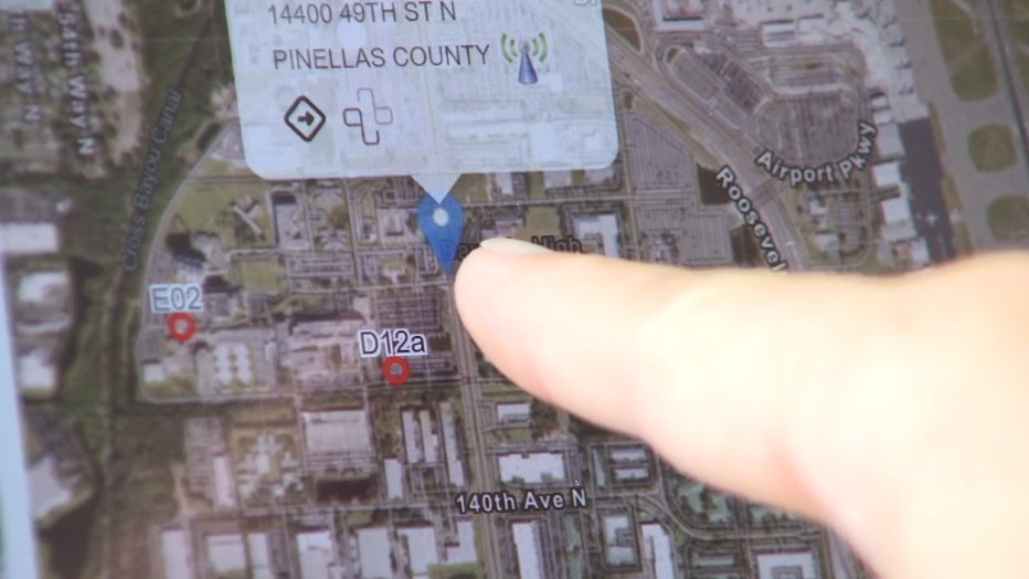 Photo: Pinellas deputy points at location on map in relation to a live 911 call.