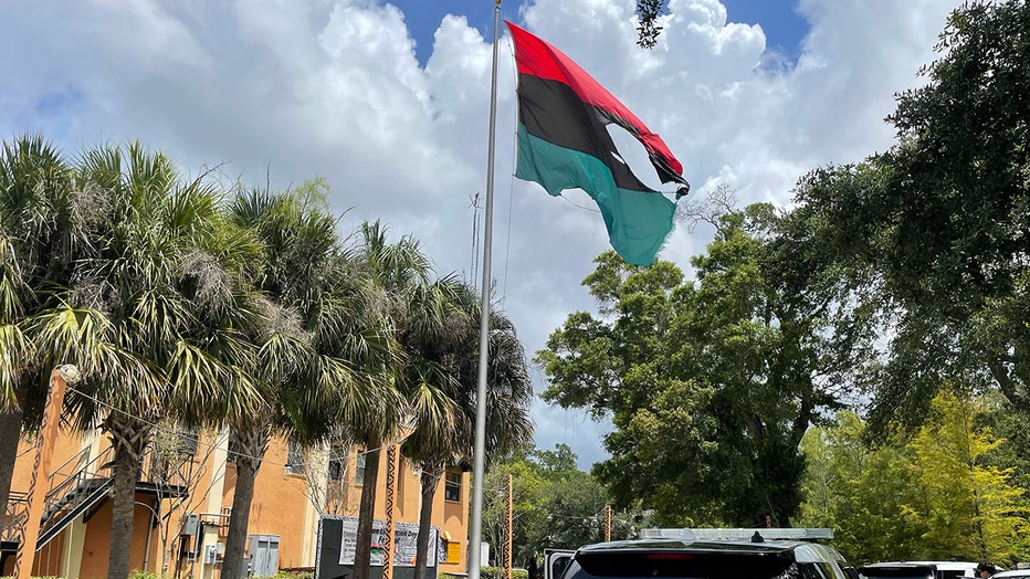 African flag damaged by fire from flamethrower