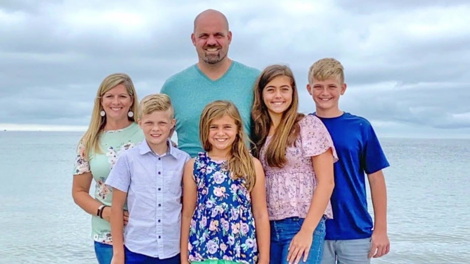 Levi Stock and family at beach. 