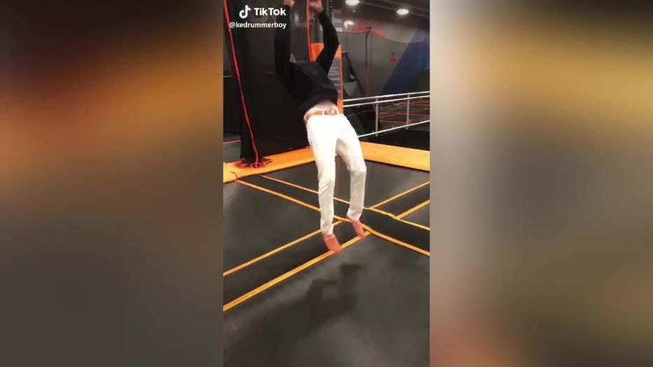 Kechardae ‘Ke’ Callins doing back flip on trampoline on TikTok. 