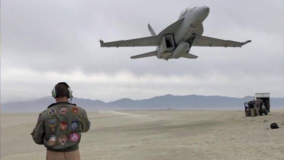 Brian Ferguson with plane in desert