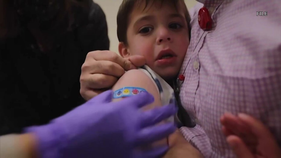 Child getting a vaccine.