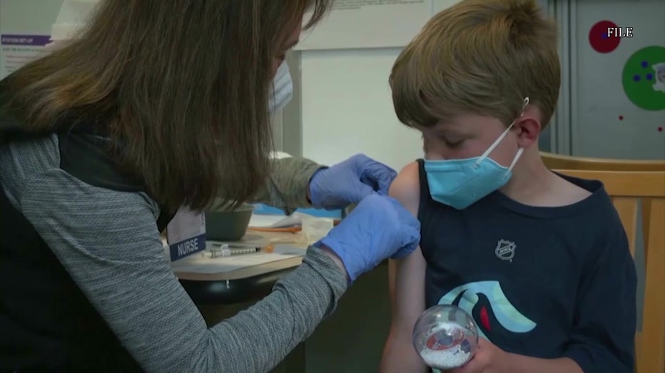 Child getting a vaccine.