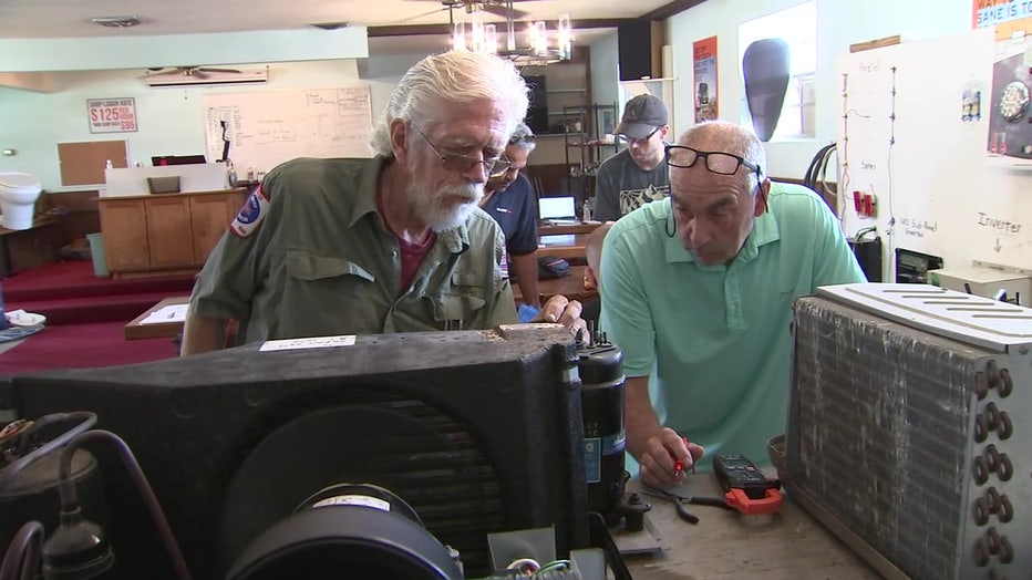 Students at RV Tech Training Center work on machine.